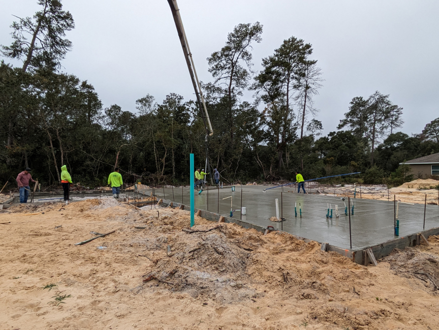 8 Slab pouring, with boomtruck and concrete trucks